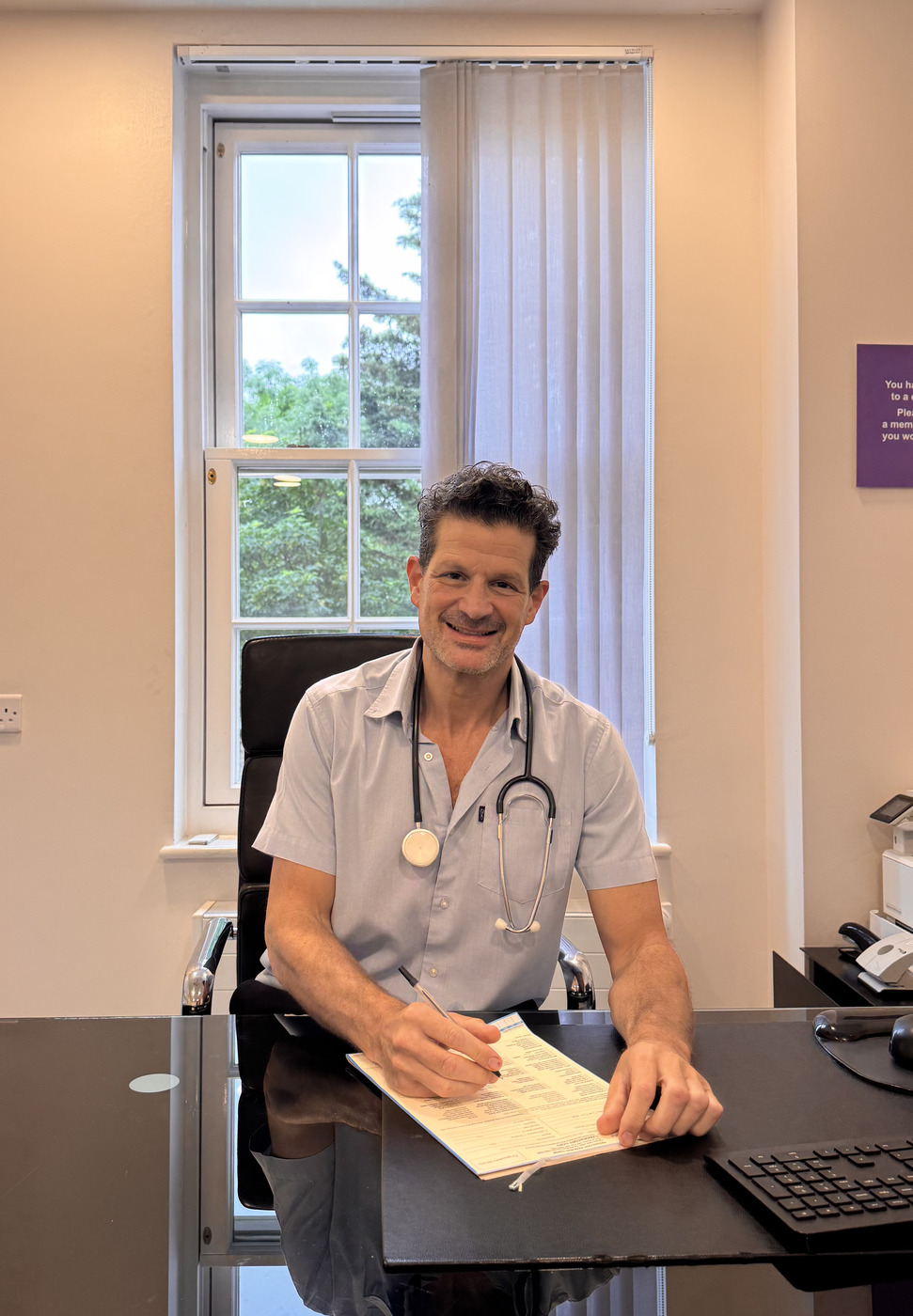 Dr Adam Wander, London GP, in his consulting room